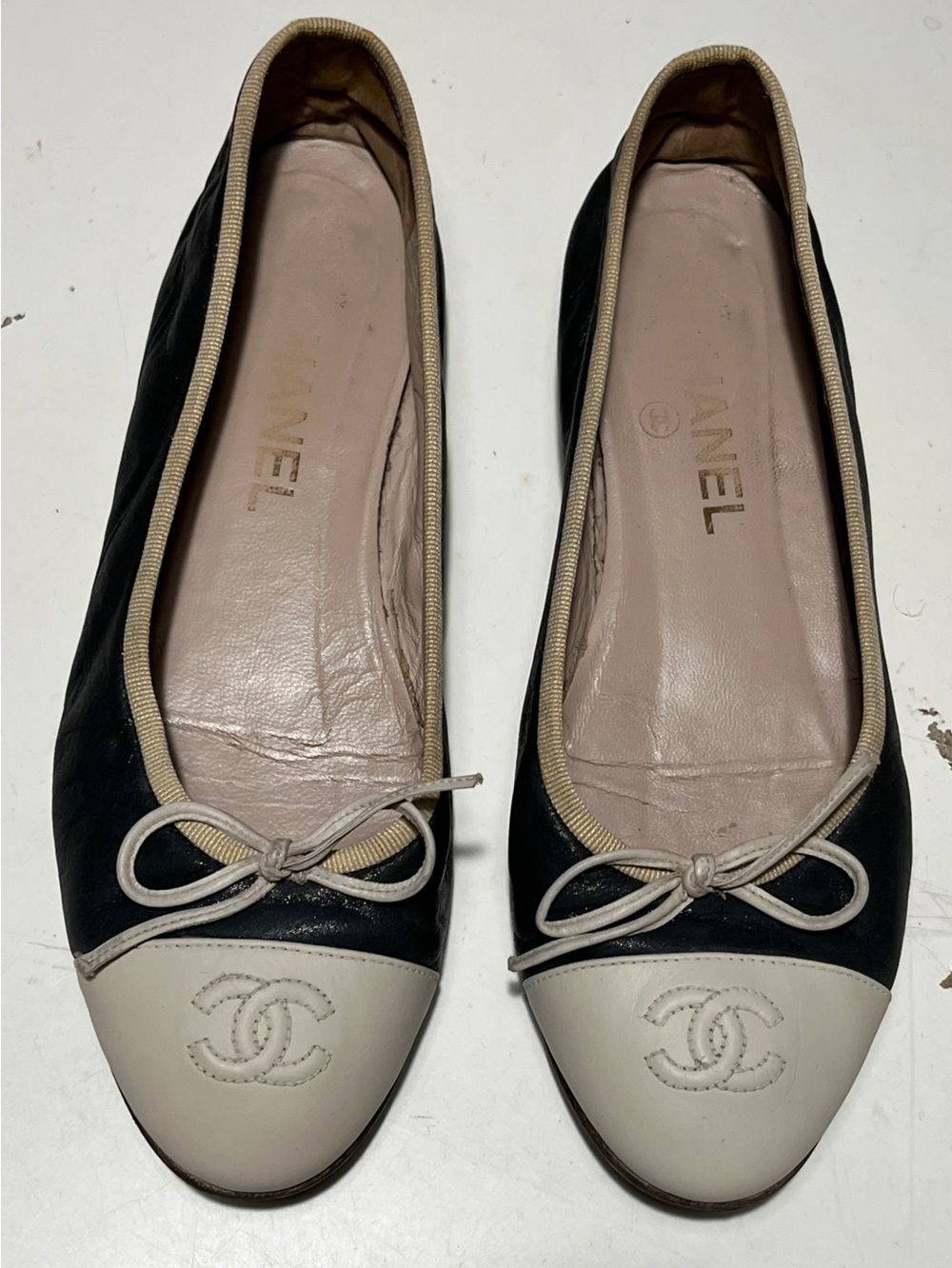 CHANEL Black Leather Ballet Flats with Cream Cap Toe